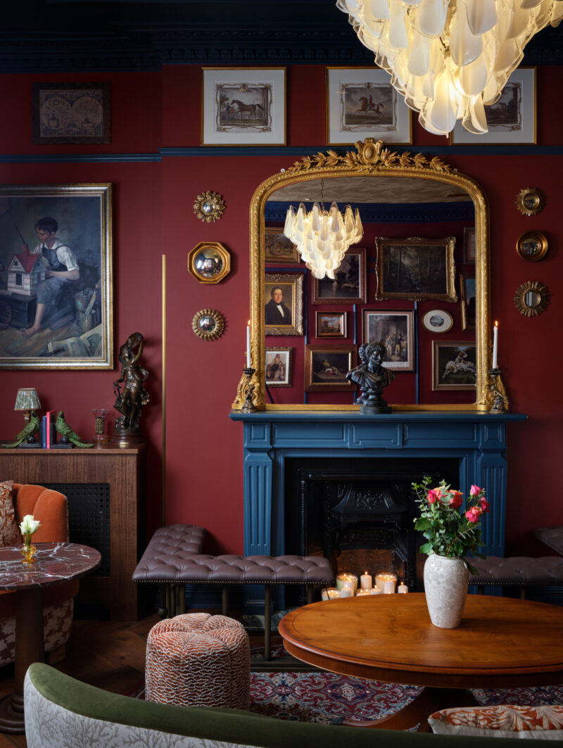 Ottie's Salon at bertrand's townhouse with large gold ornate mirror