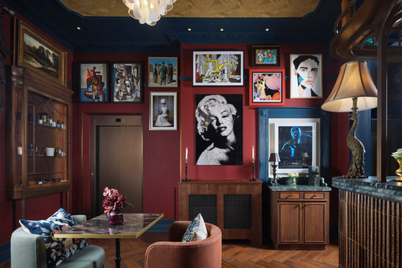ottie's salon at bertrand's townhouse with picasso type cubism art work and marilyn monroe