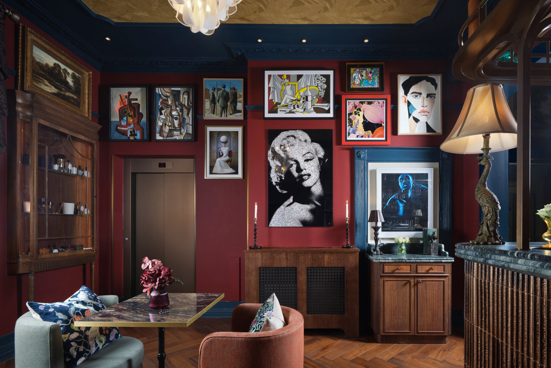 ottie's salon at bertrand's townhouse with picasso type cubism art work and marilyn monroe