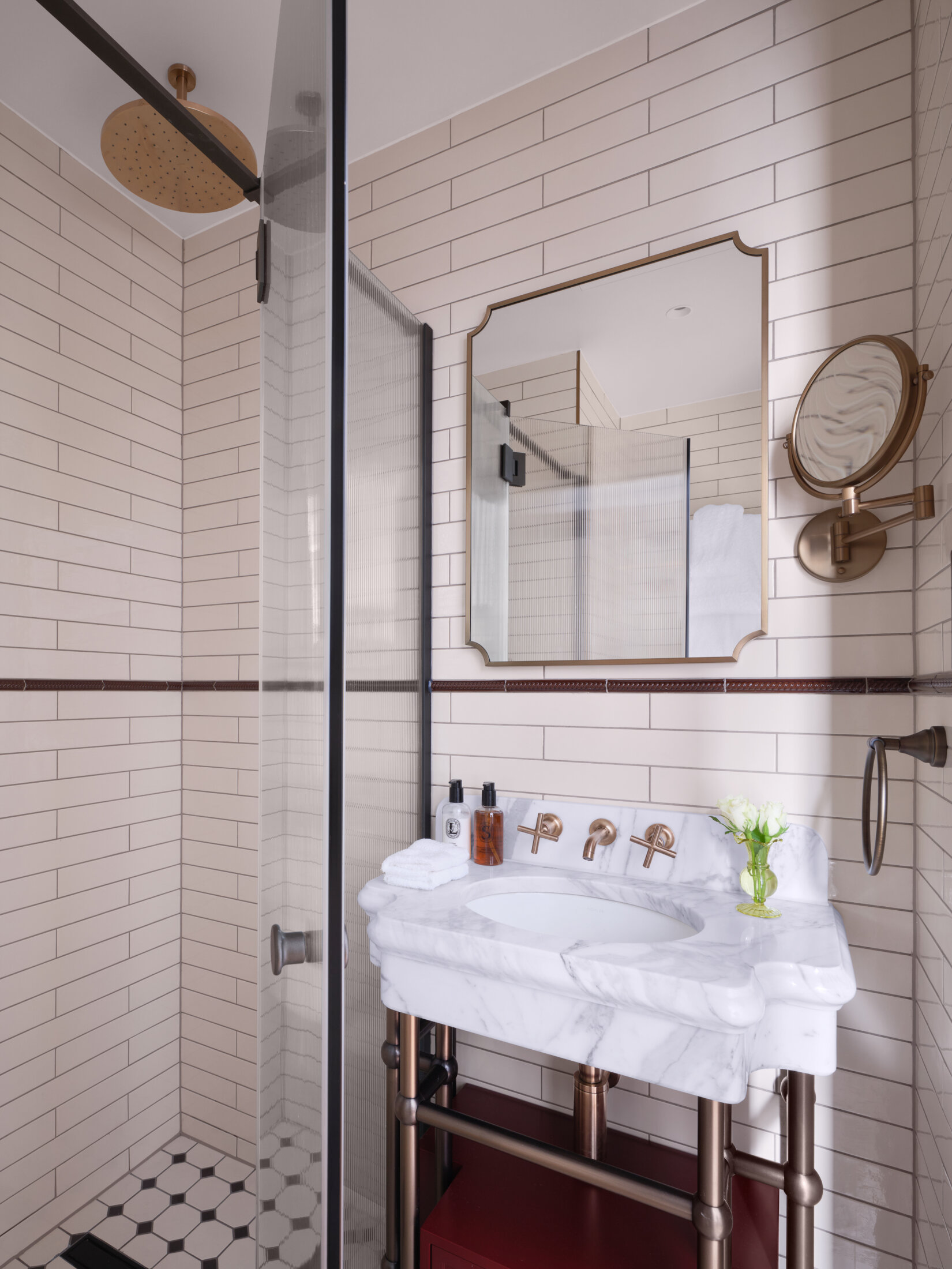 Hotel bathroom with gold accents