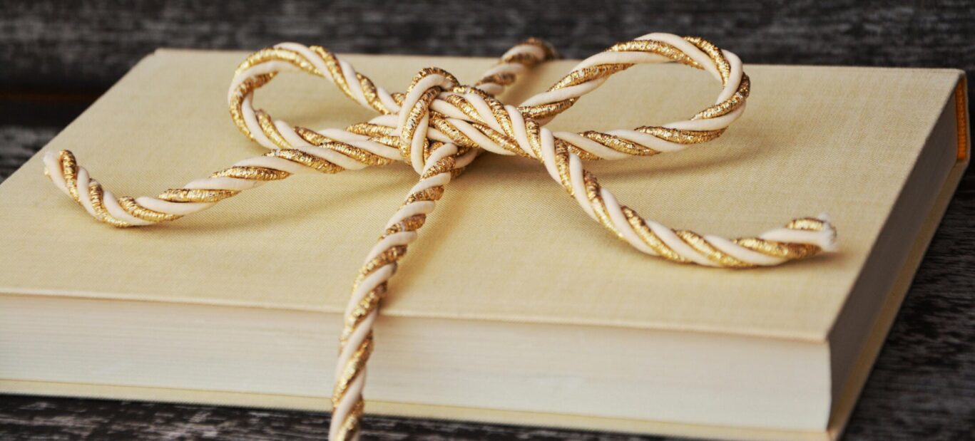 book wrapped with a gold rope