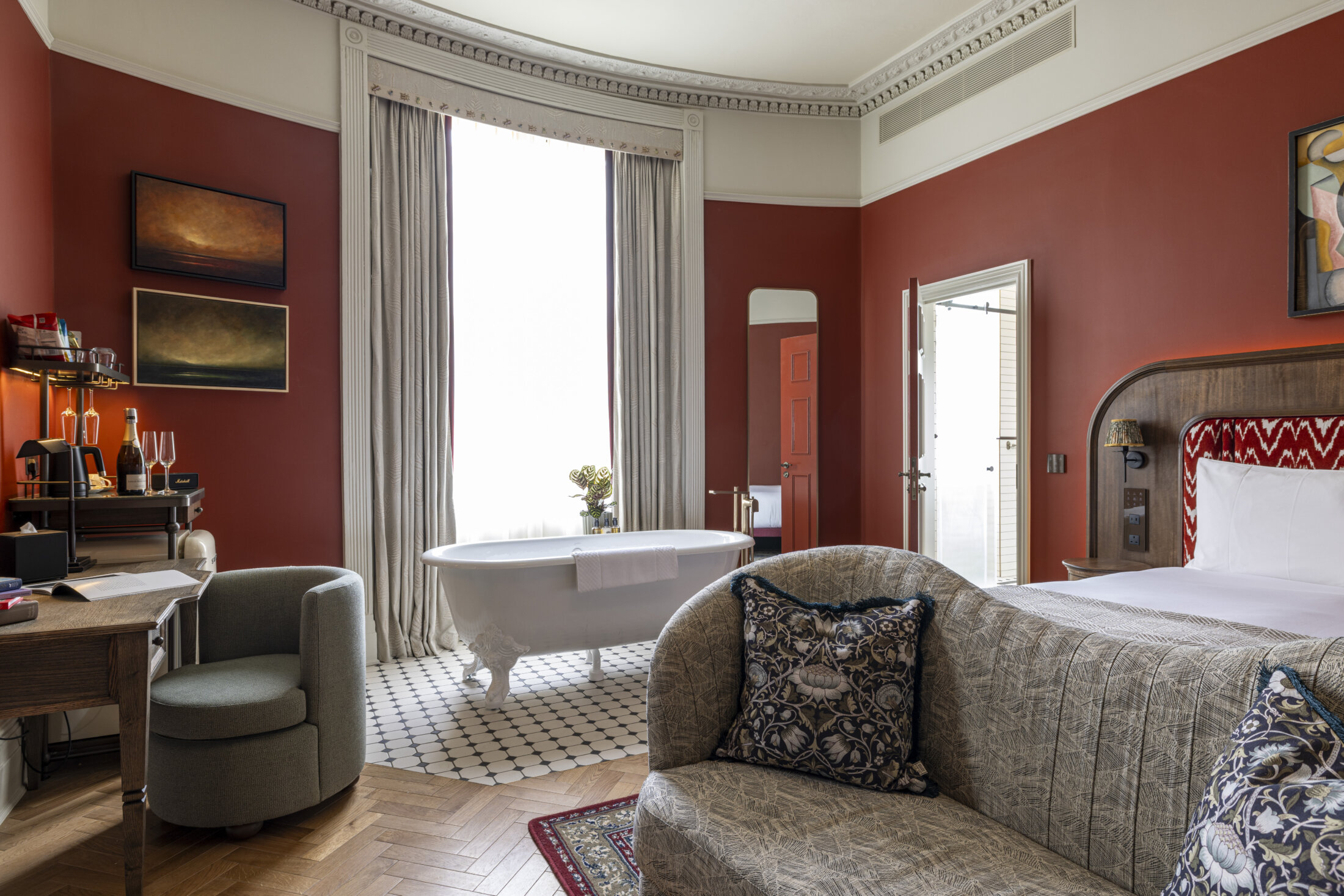 large roll top freestanding bath in hotel bedroom