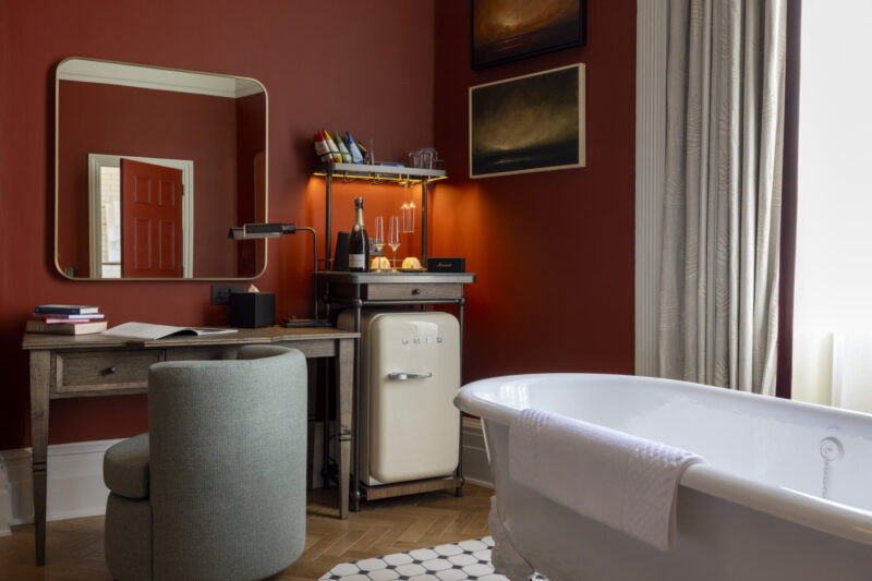 large roll top freestanding bath in hotel bedroom