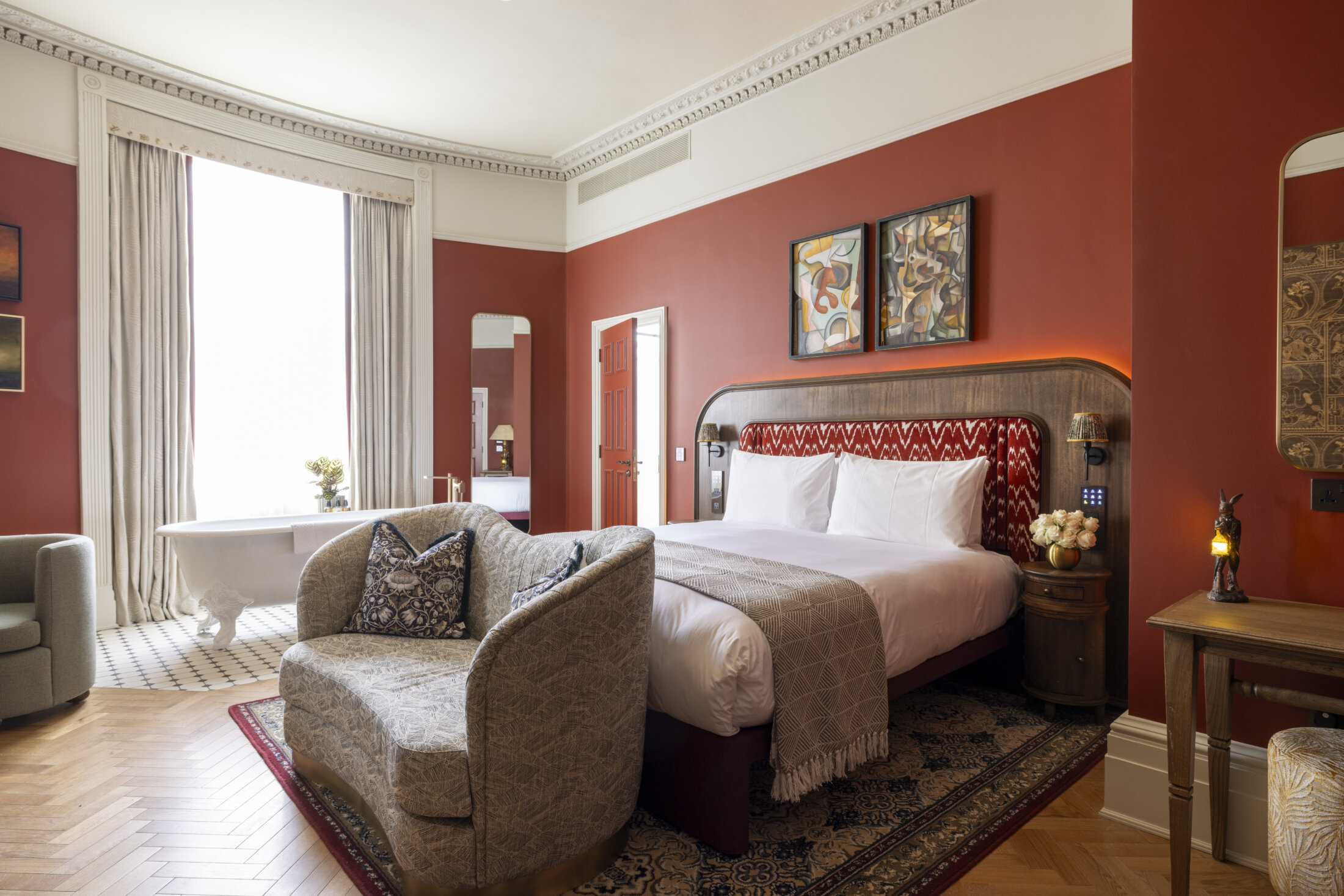 large roll top freestanding bath in hotel bedroom