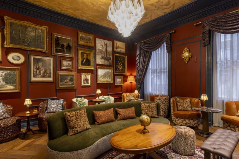 ottie's salon at bertrands townhouse with green sofa and chairs