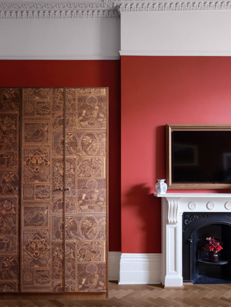 large suite hotel dark red walls with Japanese style wardrobe