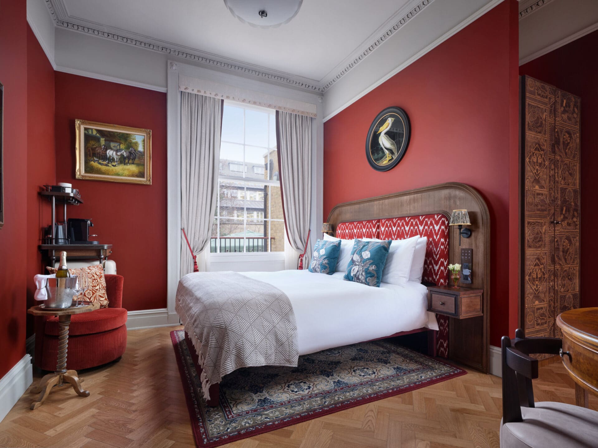 large suite at hotel bertrands townhouse with dark red walls