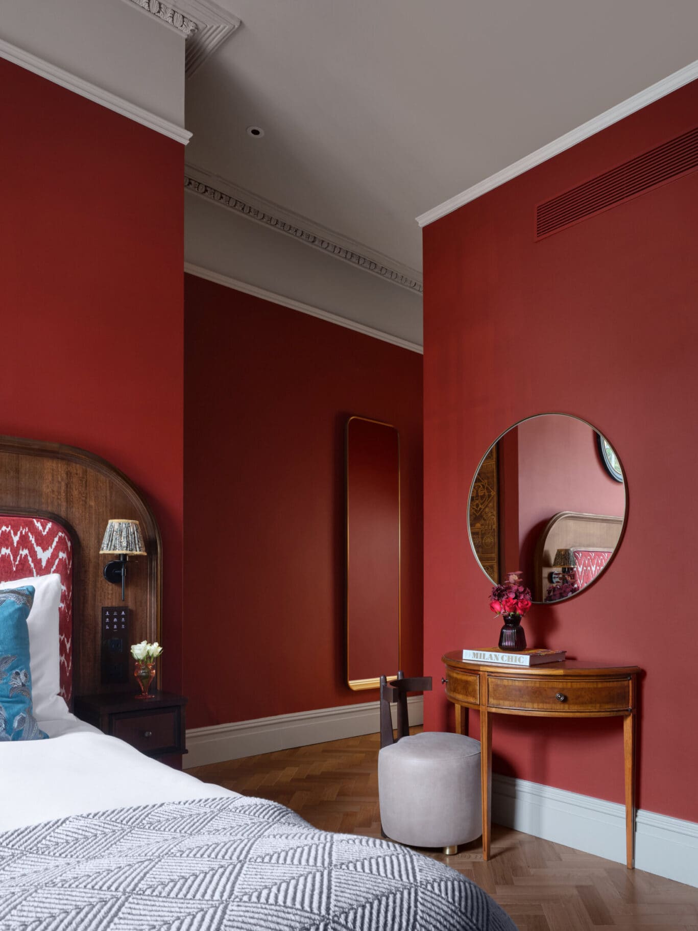 main suite at bertrands hotel with dark red walls