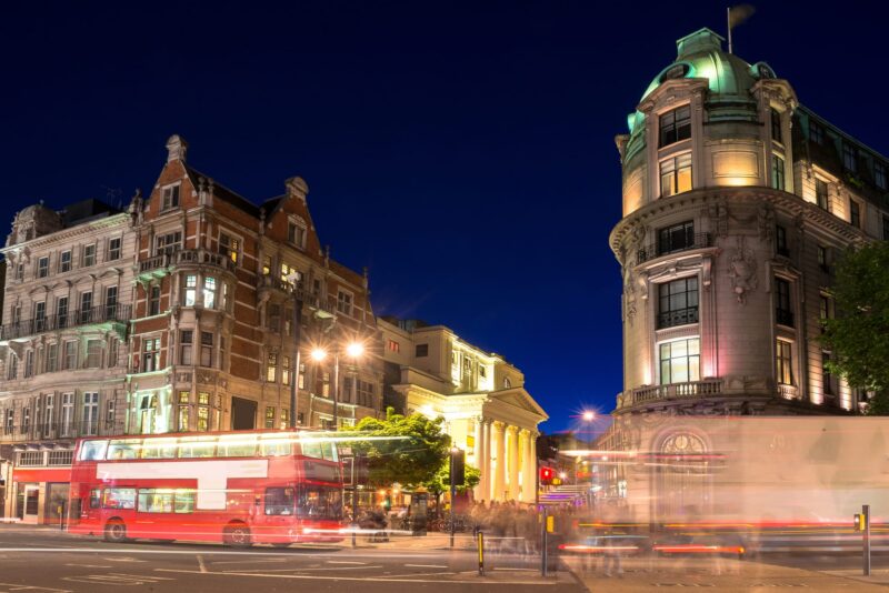 The West End at night with lots of traffic.